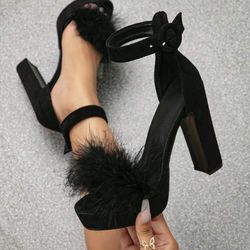 elegant black high-heeled shoe