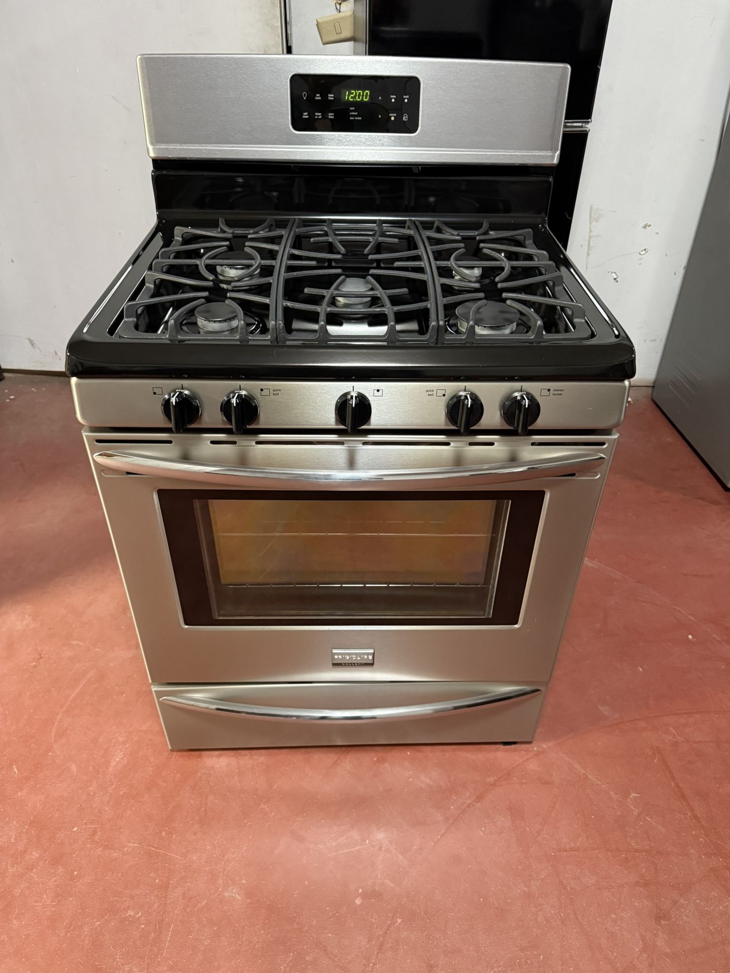 Frigidaire 5-burner gas stove in perfect working condition. Delivered to your home and installed with a 3-month warranty.