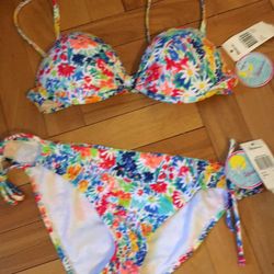 Brand-new with tags Raisins Bikini size medium. Push up top. Never worn. I ordered online and it does not fit. Super cute.