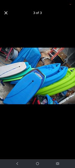 6 KAYAKS. 3 GREEN 7.5 FT TALL 3 BLUE 6 FT TALL. 8 MOREY BOOIE BOARDS. FOR SALE AND RENTAL!!