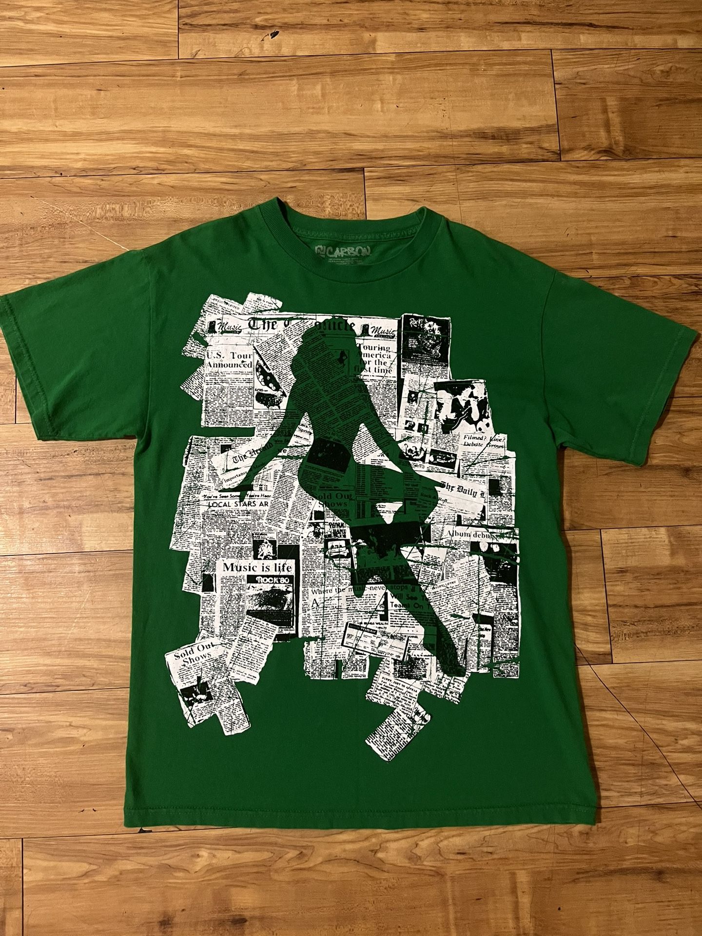 lady on newspaper green shirt