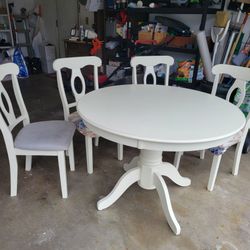 Round pedestal dining table with 4 chairs