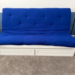 Futon made from wood with full-size mattress