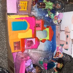 Brand new Encanto doll set with house and three dolls and all accessories box is open, but never taken apart brand new