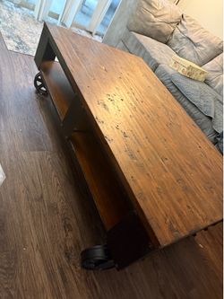 Solid wooden coffee table with hardware weals