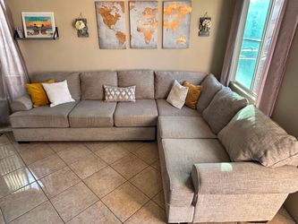 Large and super comfortable beige sectional couch from Jerome’s