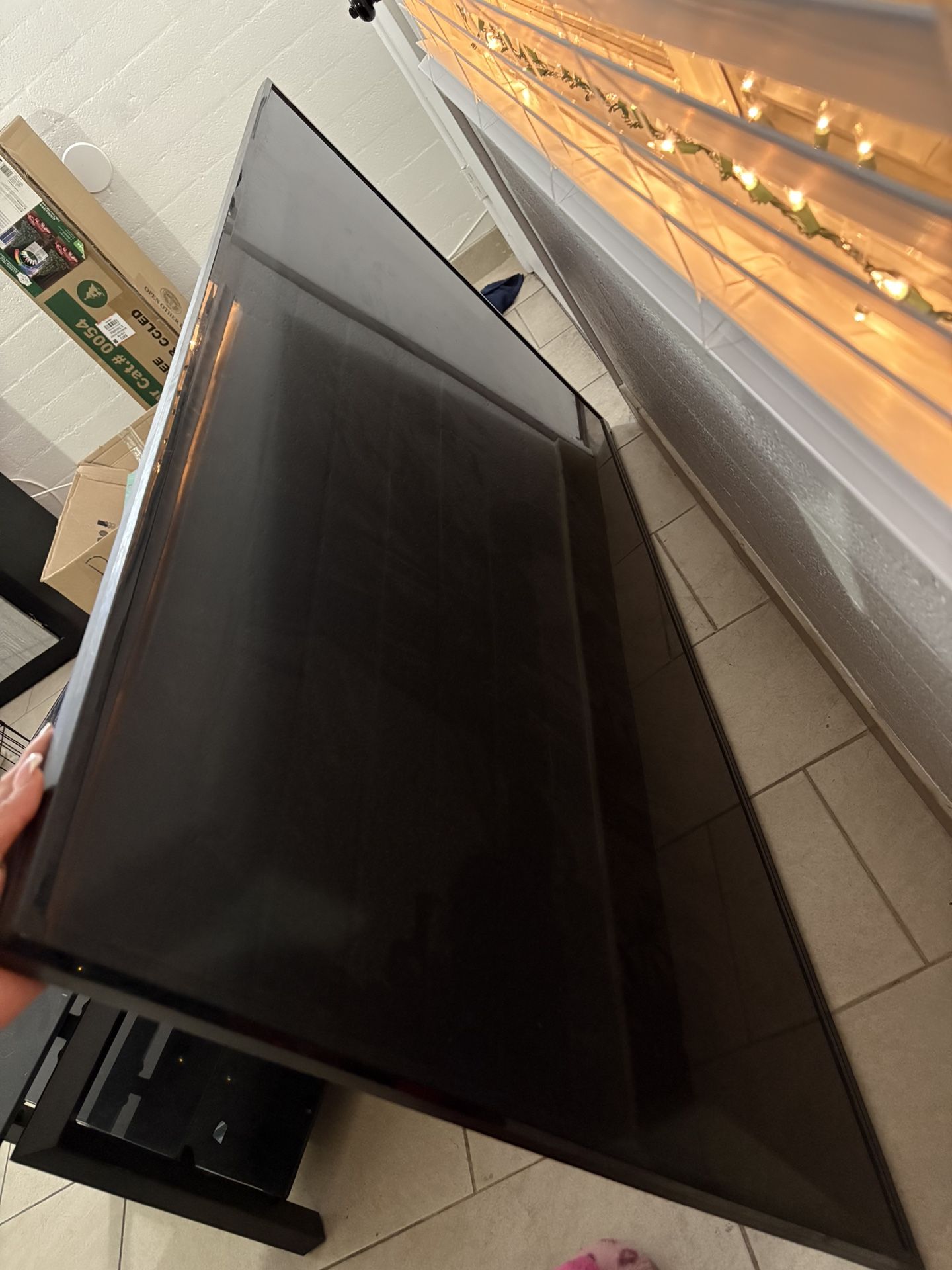 Tv Stand And A 75 Inch Tv