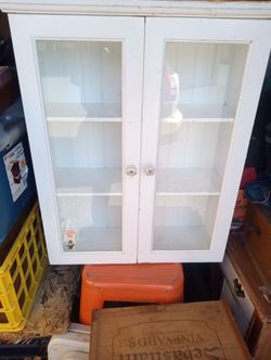 Small white glass cabinet