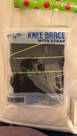 Knee brace with strap