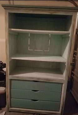 Light blue stressed armoire