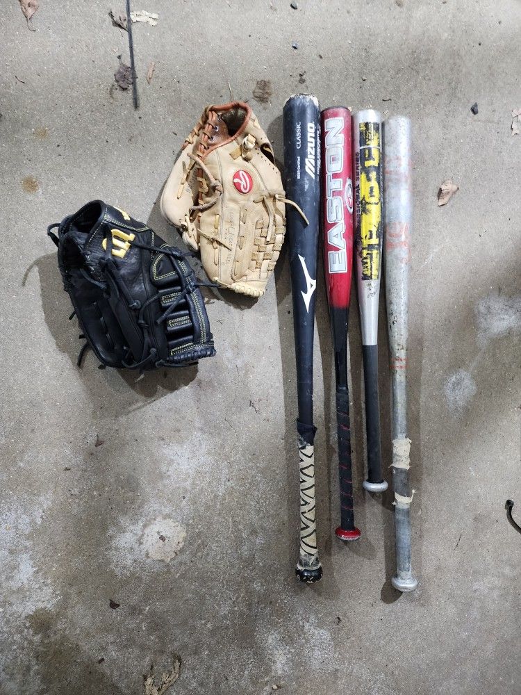 Baseball Stuff. 2 Gloves. 4 Bats. Few Balls And A Bag