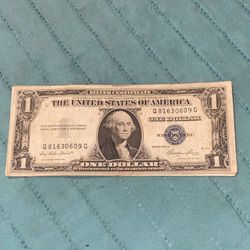 1935 Series $1 Silver Certificate, identifiable by its blue treasury seal and the "Silver Certificate