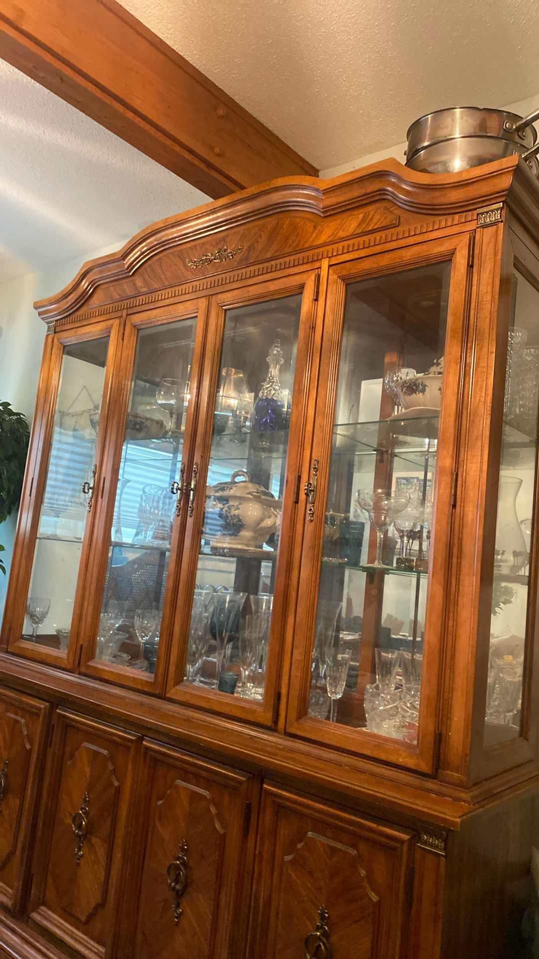 Dining room set firm wood very heavy sturdy not the plywood comes with a wine case I have a lot of China dishes. in pristine condition always covered.