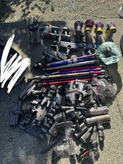 Large Lot of Dyson Vacuums And Accessories For parts/as is