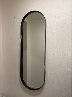 Black metal pill mirror