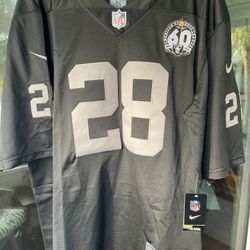 RAIDERS NFL JERSEY, NEW WITH TAGS, #28 JACOBS SIZE XL