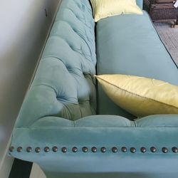 Beautiful 7 ft  teal tuffted sofa 