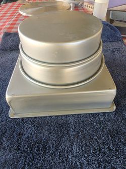 Cake pans, metal turntable, and leveling saw