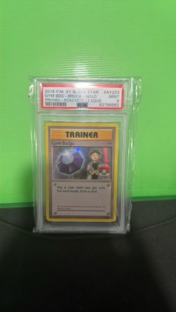 2016 POKEMON XY BLACK STAR PROMO POKEMON LEAGUE GYM BADGE-BROCK-HOLO PSA 9