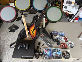 Sony PlayStation 3 PS3 Slim 320GB Console Rockband Drums Guitar Hero W/ 9 Games Sony PlayStation 3 (PS3) Slim 320GB Console, model CECH-3001B, fully t