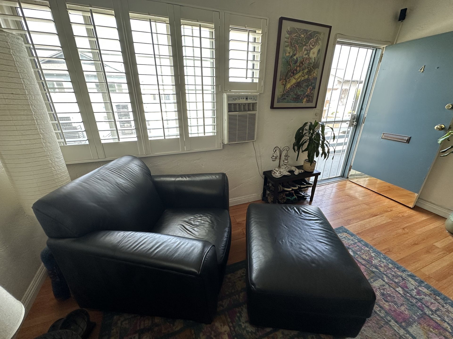 Klaussner Black Leather chair & Ottoman