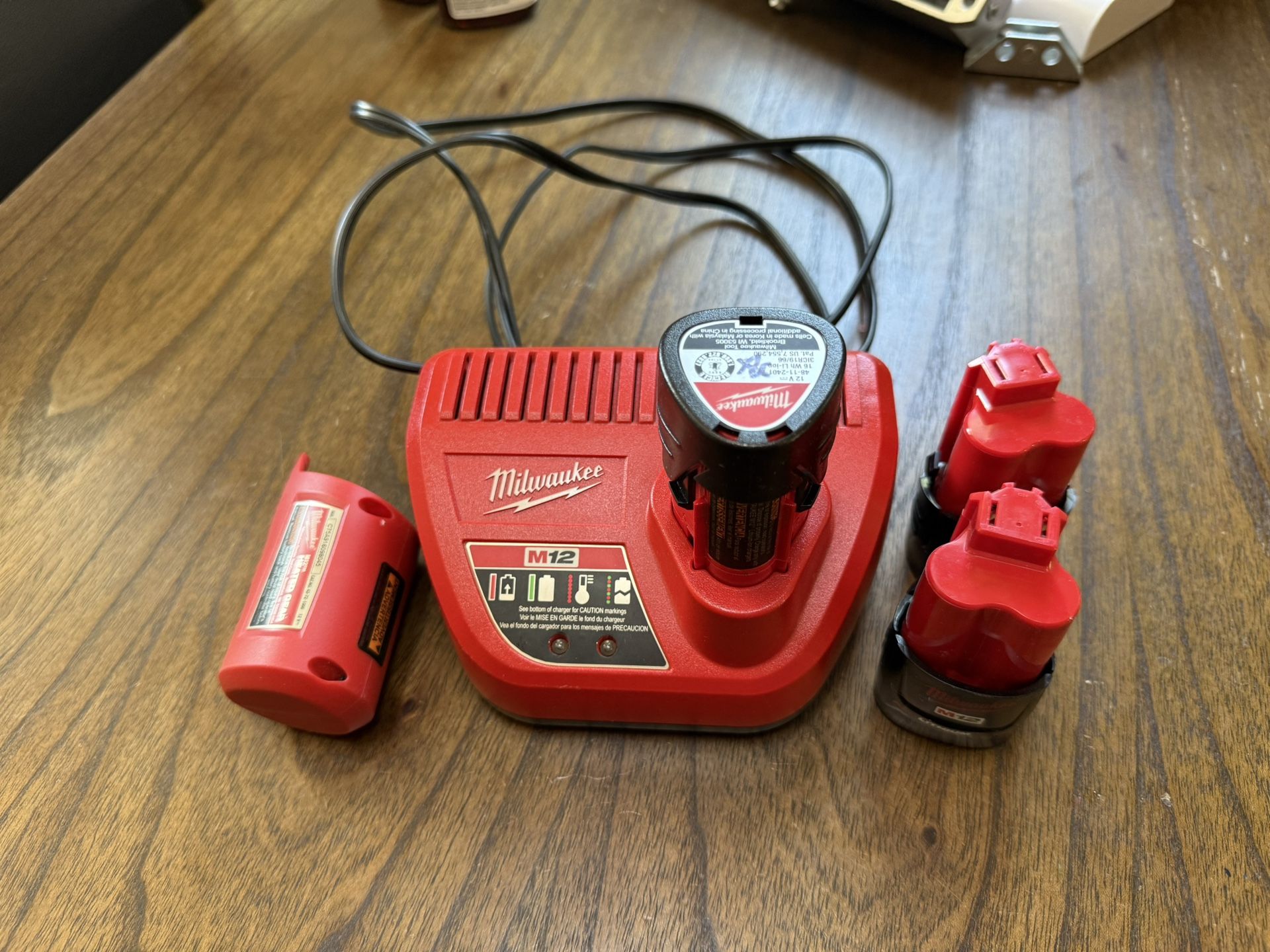 Milwaukee Charging Base, 3 Batteries And Top Off Portable Charger