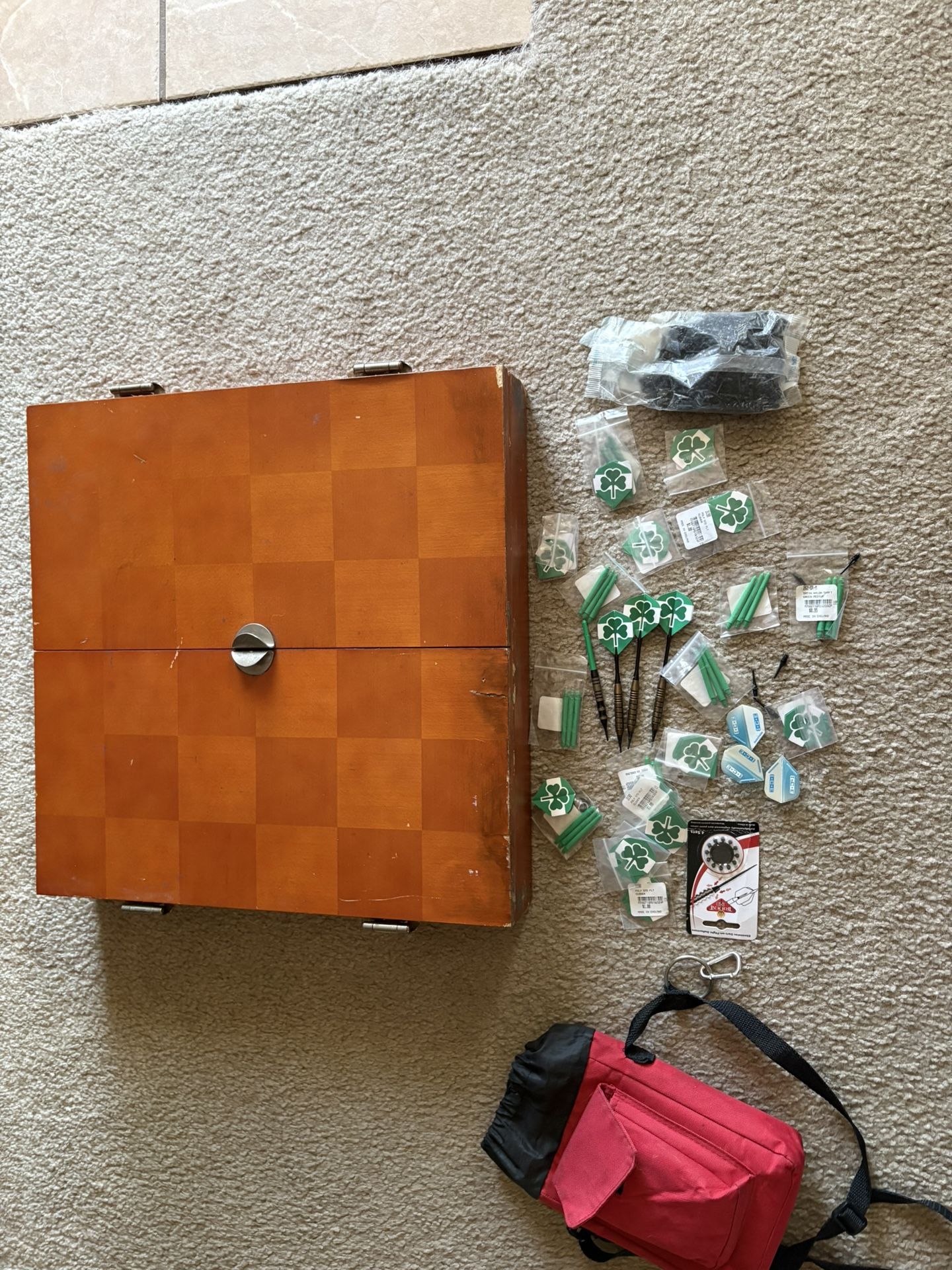 Cork, dartboard and holder and dart accessories.