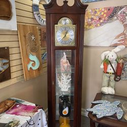 Howard Miller Grand Father Clock With Shelves
