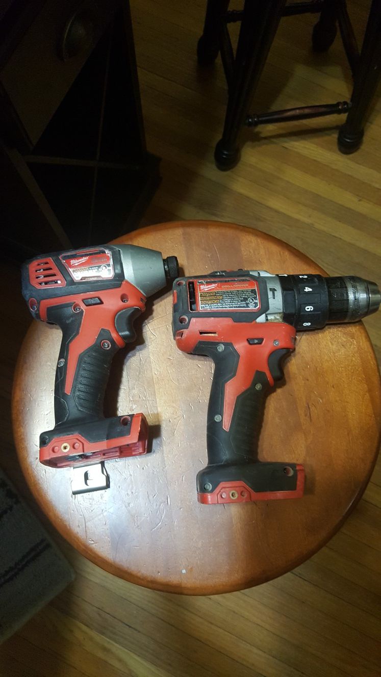 Milwaukee impact and hammer drill used. No battery or charger included works great