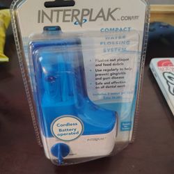 Interplak compact water flossing system