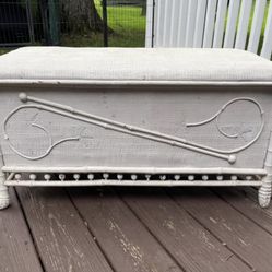 Lovely old white wicker or nightly embellished chest with lid. Sturdy piece.