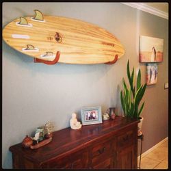 Surf board wall rack