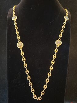 $8 Gold tone chain link faux coin necklace with small crystal rhinestones. Necklace is 36 inches.