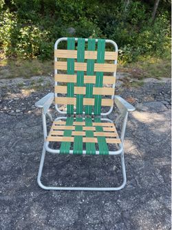 Vintage webbed aluminum folding lawn chair