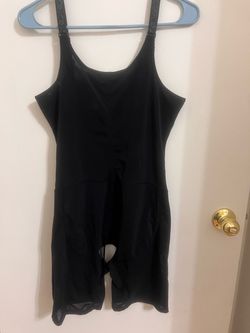 Classic black one-piece swimsuit for girls. Smooth, stretchy fabric provides comfortable coverage and easy movement. Slim straps and a modest neckline