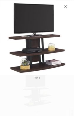 New assembled tv stand hold up.to.70 inch tvs
