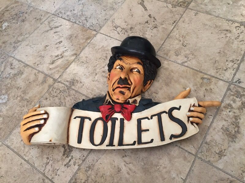 Charlie Chaplin toilet sign by Allan Agohob