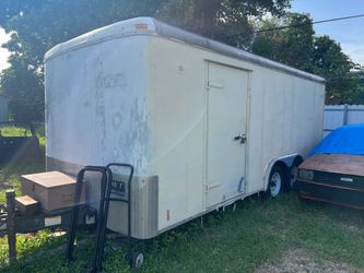 Cargo trailer with two ramps and a door