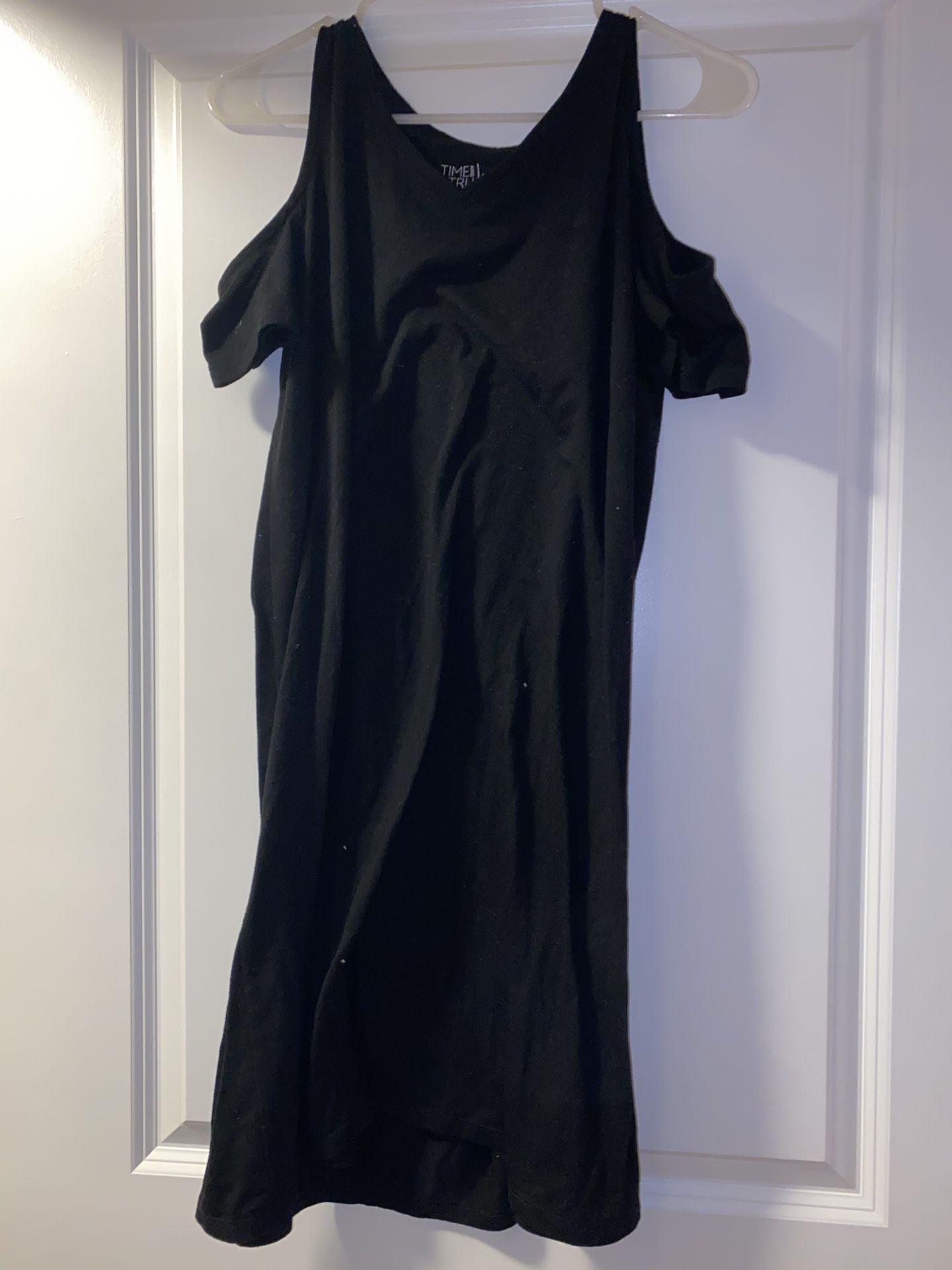 Black cold shoulder dress with a slight tear at the top Size Medium 