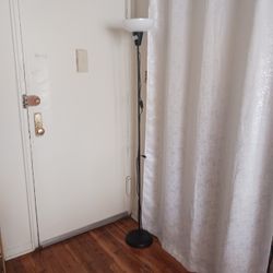 Ikea floor lamp New with energy  bulb. 
High quality lamp.
I disassembled to carry  in a bag.
Only 6 dollars.
Incredible deal 