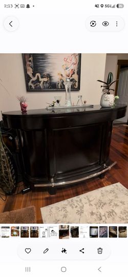 Gorgeous home bar with two adjustable stools okay