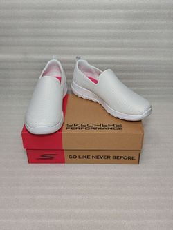 Skechers slip on sneakers. New in box. White. Washable. Size 8.5 women's shoes