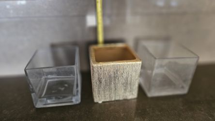 Three glass flower holders/ vases