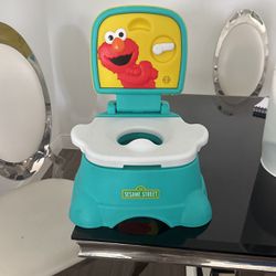  Overall Pick Sesame Street Elmo Hooray! 3-in-1 Potty Chair, Toilet Trainer, and Step Stool, Pretend Flush Handle, Gender Neutral Toddle... More Like 