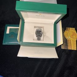 It’s a Rolex Day Date Oyster Perpetual