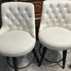2 White Leather Swivel Chairs