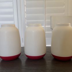 white vases with a red bottom