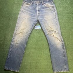 Vintage Levi 501 light wash distressed jeans
