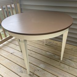 Brown And Ivory Round Top Table With Accent Legs
