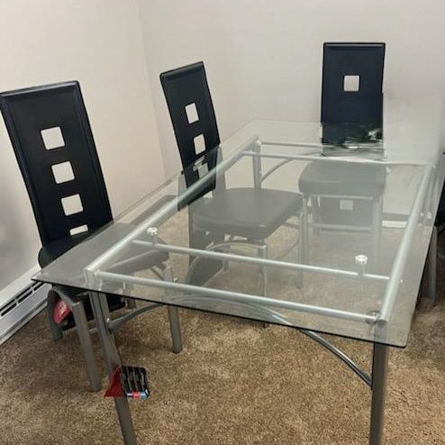 GORGEOUS Glass Top Dining Table & 6 BRAND NEW Modern Black Chairs - a STEAL!